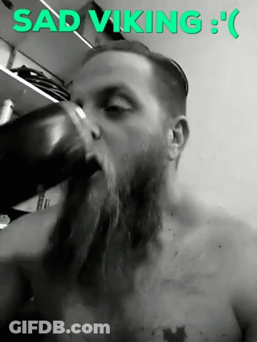 Sad Viking Man With Beard Drinking From Cup GIF