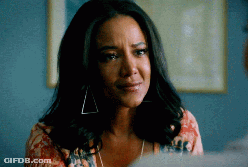 Sad Woman Wearing Earrings GIF