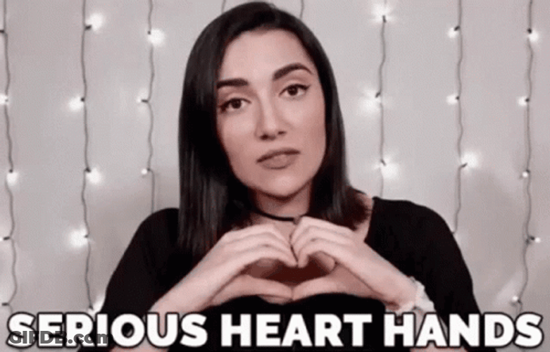Safia Nygaard Serious Heart Hands GIF
