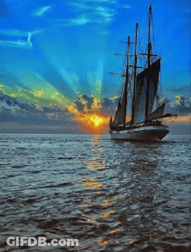 Sailboat In Ocean At Sunset GIF