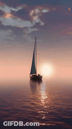 Sailboat In Ocean At Sunset GIF
