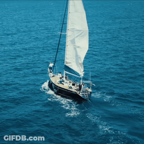 Sailboat With Large Sails In Ocean GIF