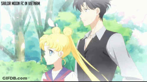 Sailor Moon Fc In Vietnam Shows A Man And A Girl Standing Next To Each Other GIF