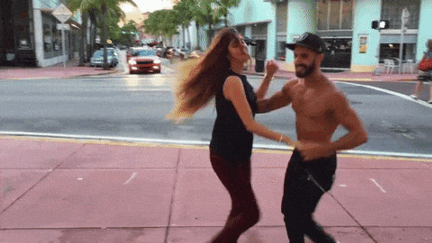 Salsa Man And Woman Dancing On The Street GIF