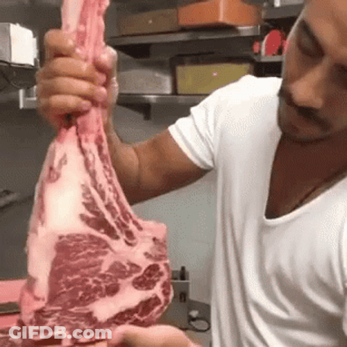 Salt Bae Showing The Marbled Of Tomahawk Meat GIF