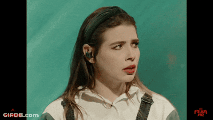 Sam Seum Ear Plugs While Wearing Headband GIF