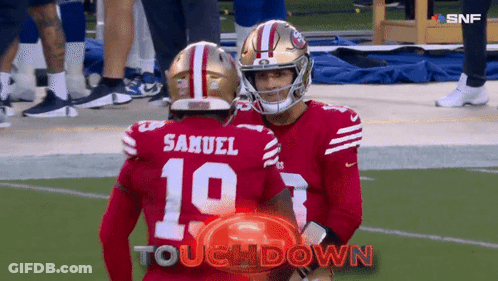 Samuel And Number 10 Are Hugging Each Other On The Football Field GIF