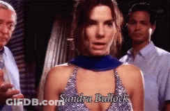 Sandra Bullock Standing In Front Of Two Men GIF