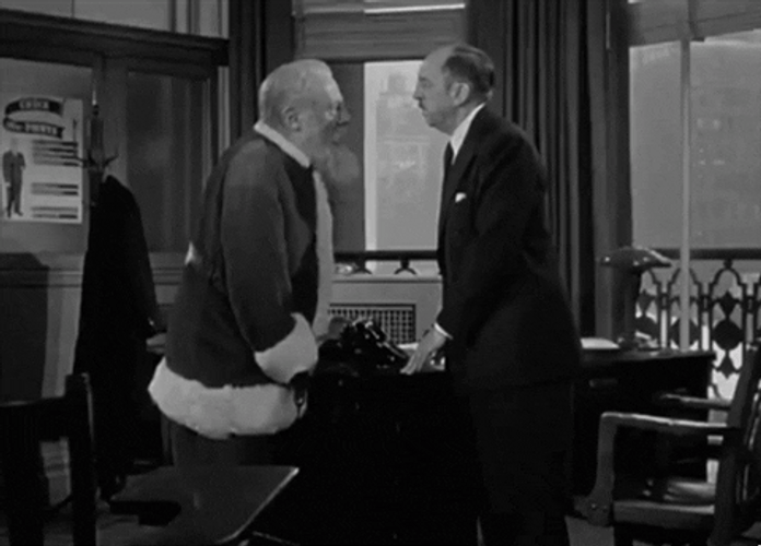 Santa Beats The Man Head GIF