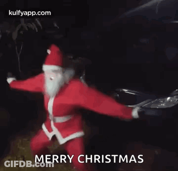 Santa Claus Dancing In Front Of Car In Dark GIF