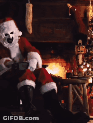 Santa Claus Sitting By Fireplace With Christmas Tree GIF