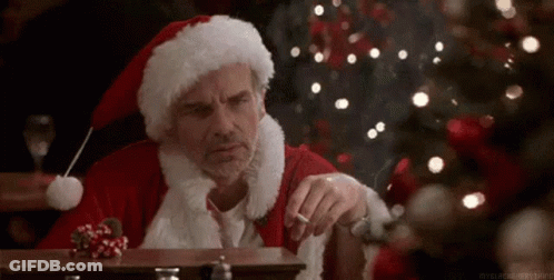 Santa Claus Smoking Cigarette At Table GIF