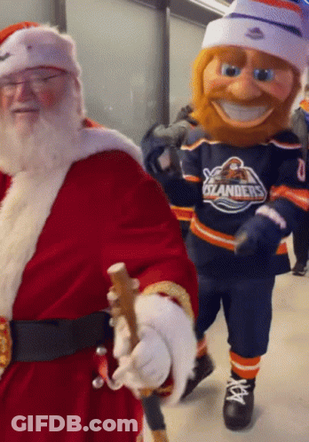 Santa Claus Walking Next To Oilers Mascot GIF
