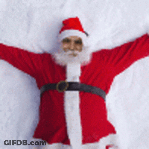 Santa Laying On Snow With Arms Outstretched GIF