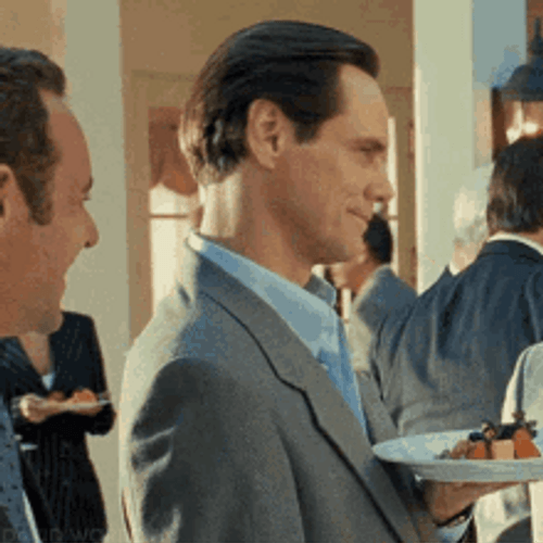 Sarcastic Laugh Arrogant Bitter Reaction Jim Carrey GIF