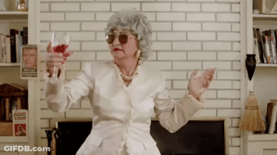 Sassy Old Lady Dancing While Drinking Wine GIF