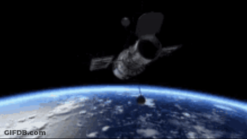 Satellite Flying Over Earth At Night GIF