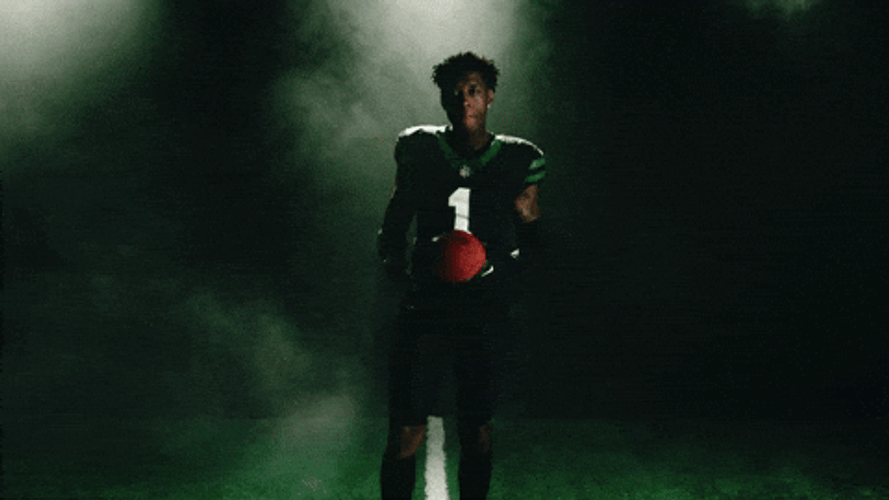 Sauce Gardner Tossing Football Between Hands GIF