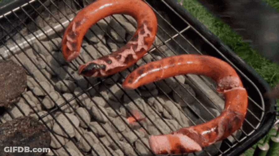 Sausage Being Harshly Slices On Grill GIF