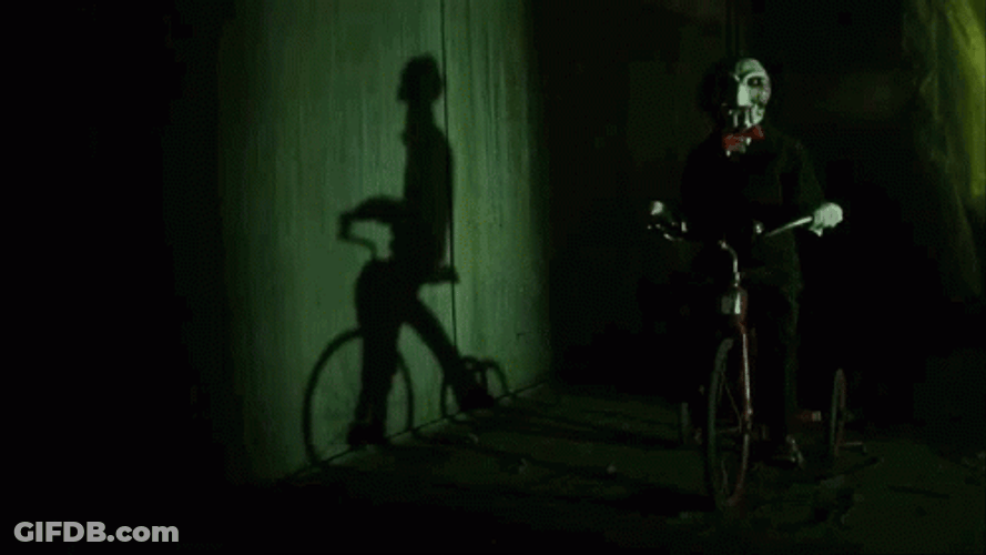 Saw Billy The Puppet Riding Bicycle GIF