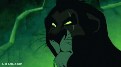 Scar From The Lion King Staring With Glowing Green Eyes GIF