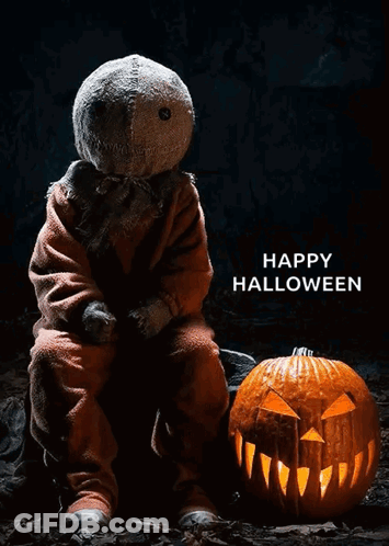 Scarecrow Sitting Next To Carved Pumpkin Happy Halloween GIF