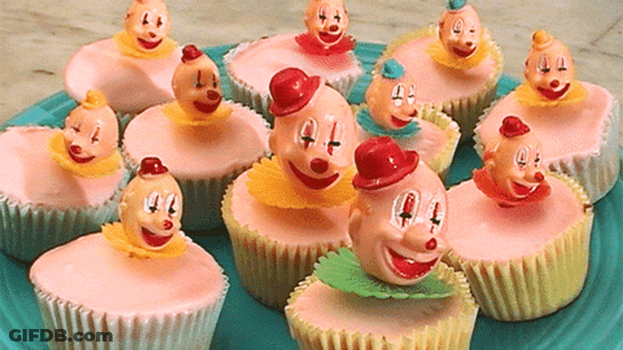 Scary Clown Head Spinning In Cupcakes GIF