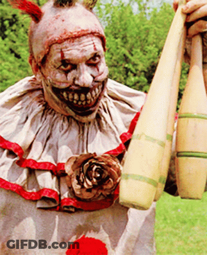 Scary Clown Holding Kettlebells GIF