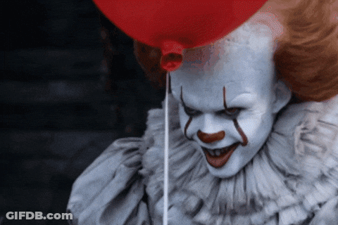 Scary Clown Holding Red Balloon GIF