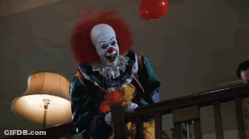 Scary Clown Holding Red Balloon GIF