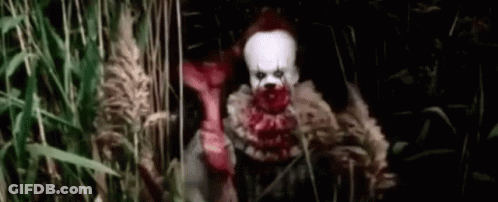 Scary Clown In Tall Grass Field GIF