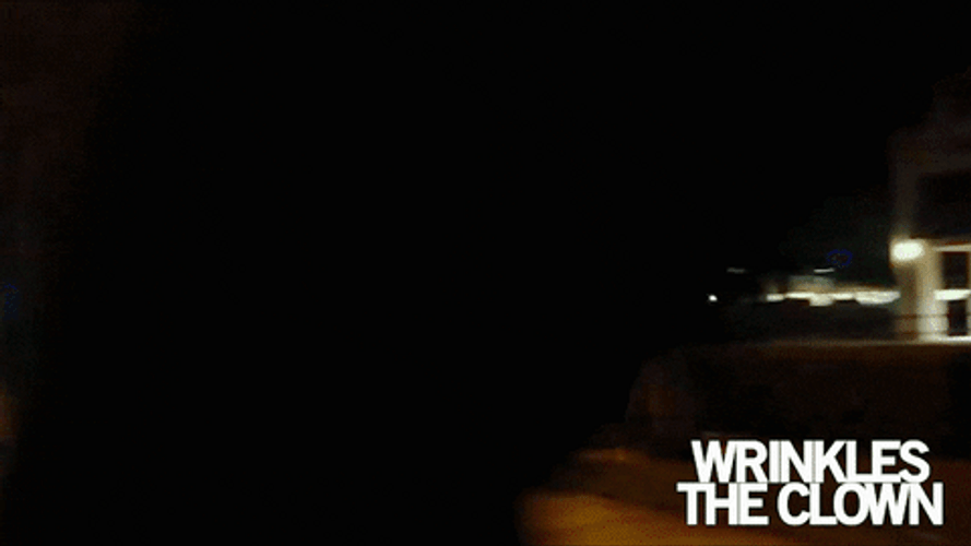 Scary Clown Walking In The Street GIF