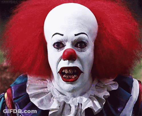 Scary Clown With Red Hair And White Face Paint GIF