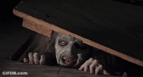 Scary Face Sticking Out Of Wooden Box GIF