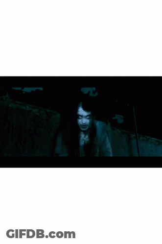 Scary Face With White Eyes On Black Background GIF