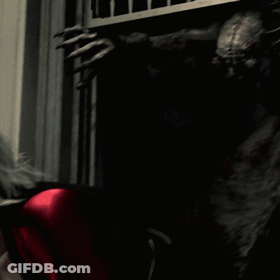 Scary Monster Standing In Dark Room GIF