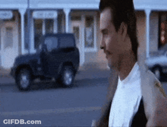 Scary Movie Officer Doofy Removing Coat GIF