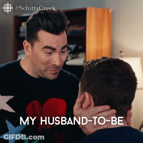Schitt's Creek Two Men Touching Faces GIF