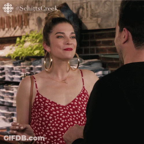 Schitt's Creek Woman Red Dress Man Black Shirt GIF