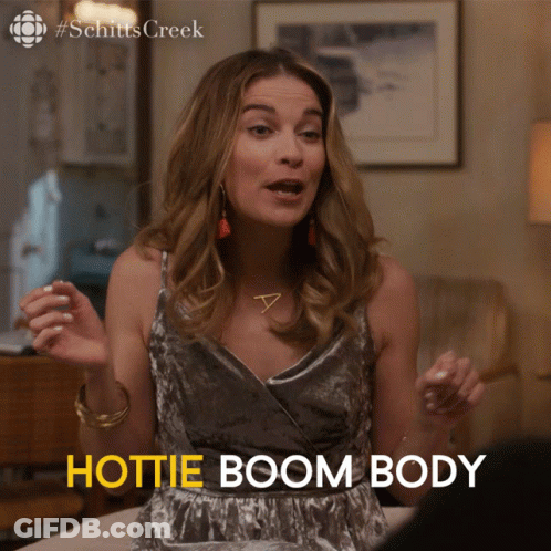 Schitt's Creek Woman Sitting On Bed Says Hottie Boom Body GIF