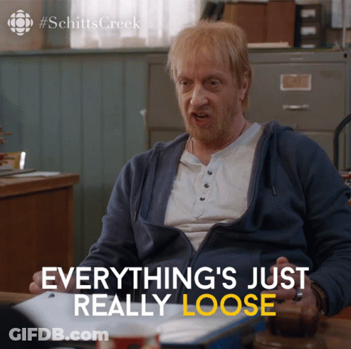 Schitts Creek Ad Man Sitting At Desk GIF