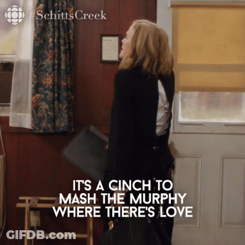 Schitts Creek Poster Woman Holding Purse GIF