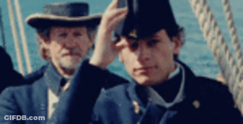Schoolgirl Saluting Boy In Dark Room GIF
