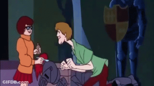 Scooby Doo And Velma Talking In Front Of Statue GIF