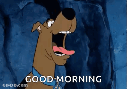 Scooby Doo Is Saying Good Morning With His Mouth Open And His Tongue Out . GIF