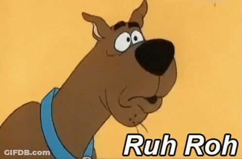 Scooby Doo Is Wearing A Blue Collar And Making A Funny Face With The Words Ruh Roh Below Him . GIF
