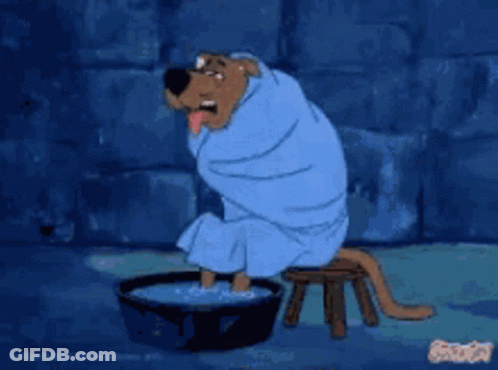 Scooby Doo Wrapped In Blue Towel Sitting On Stool GIF