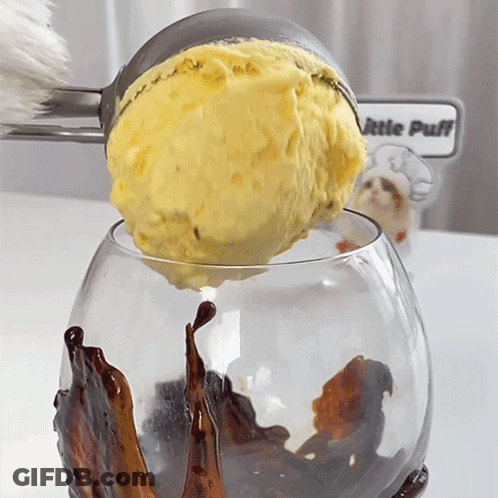 Scoop Of Ice Cream Poured Into Glass Saying Little Puff GIF
