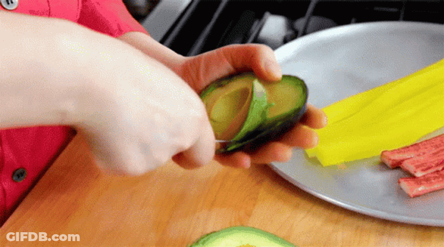 Scooping Avocado Fruit Removing Skin GIF