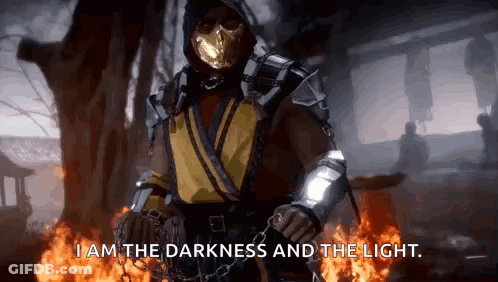 Scorpion From Mortal Kombat Is Standing In Front Of A Fire And Saying I Am The Darkness And The Light GIF